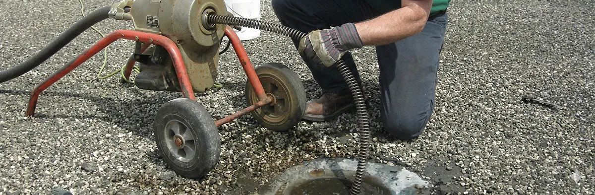 sewer rodding technician actively removing blockages from a sewer line in Glendale, AZ